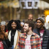 Four Temple students walking down Broad Street in Philadelphia