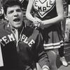 cheerleaders and cheering students with signs