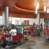 People eating in food court