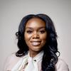 Professional headshot of a smiling person.